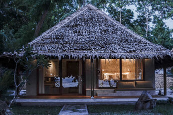 Personal bungalows are set on the beach and in a garden courtyard.